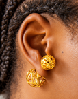 Dina Gold Openwork Sculptural Sphere Double Stud Earrings featuring two dimensional gold globes.