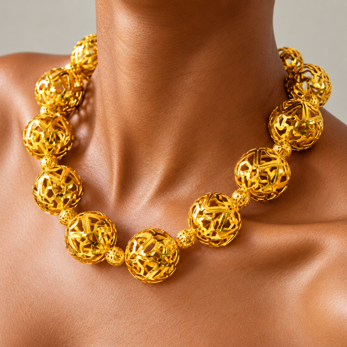 Dina Sculptural Globe Chain Gold featuring oversized openwork gold sphere beads.