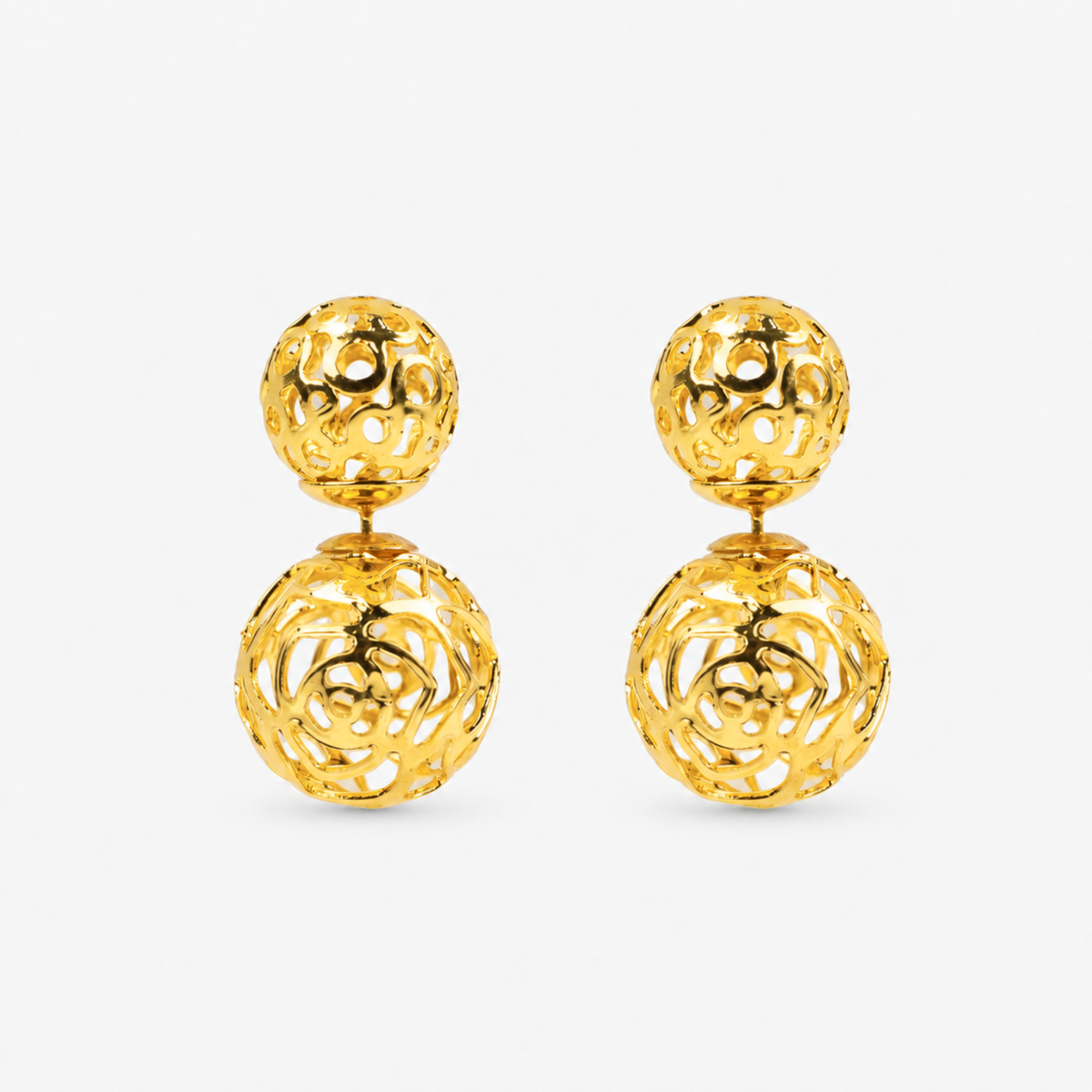 Dina Gold Openwork Sculptural Sphere Double Stud Earrings featuring two dimensional gold globes.