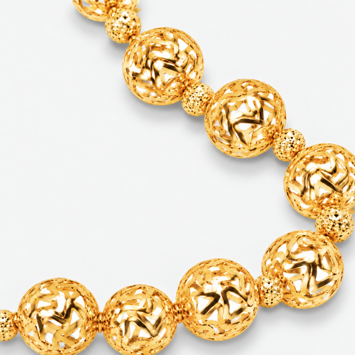 Dina Sculptural Globe Chain Gold featuring oversized openwork gold sphere beads.