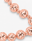 Dina Sculptural Globe Chain Rose Gold featuring oversized openwork sphere beads and smaller textured spacers.
