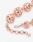 Dina Sculptural Globe Chain Rose Gold featuring oversized openwork sphere beads and smaller textured spacers.