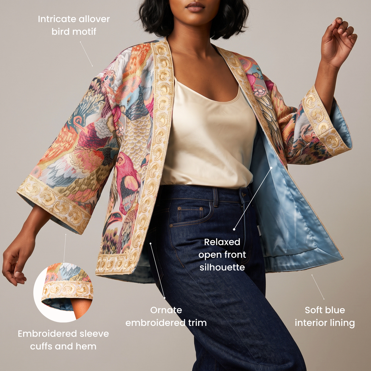 Fawna statement jacket featuring wide sleeves, ornate gold floral embroidery and a colorful allover bird motif.
