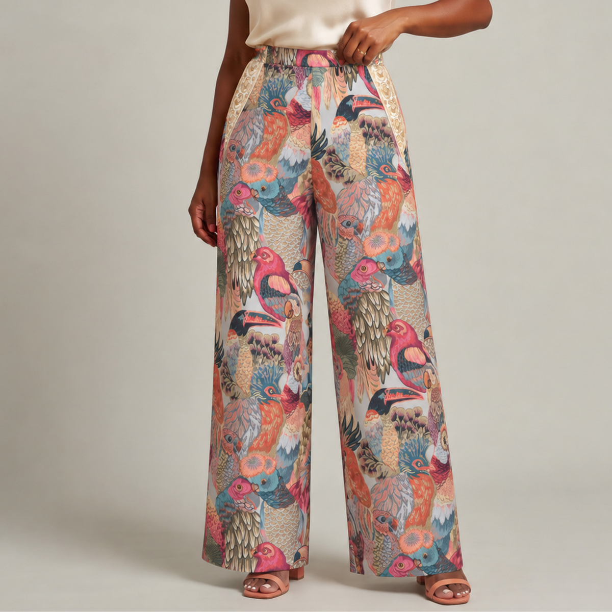 Front view of Fawna Jacquard Embroidered wide leg pants with colorful birds, open front silhouette, gold embroidery and blue lining.