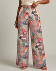 Front view of Fawna Jacquard Embroidered wide leg pants with colorful birds, open front silhouette, gold embroidery and blue lining.