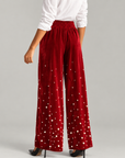 Fiorella Pant in Red Velvet Pearl featuring plush red velvet with cascading pearl embellishments.
