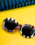 Sassy Chic accessory gift set with Genevieve Gem Stripe Sunglasses, Calypso Palm Crystal Adjustable Cuff and Untamed Luxe Scarf.