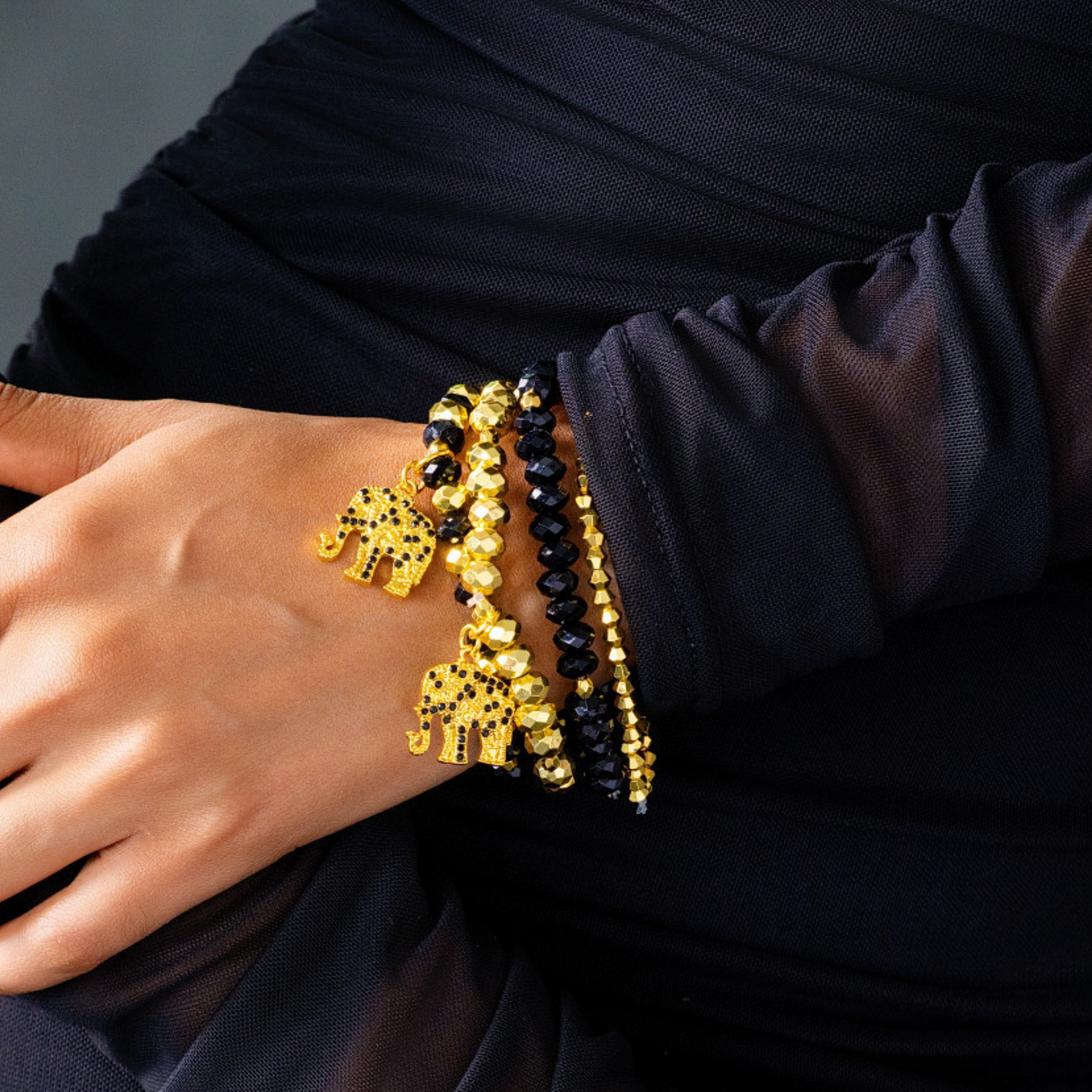 Sip, Sparkle & Slay Set featuring a black crystal sparkle tumbler, Maverick lip liner, Ibiza black crystal elephant stud earrings, and Ibiza black and gold bracelet stack.