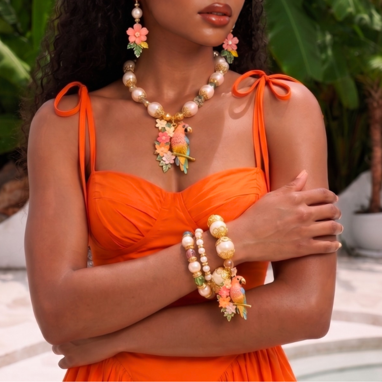 Kalani tropical parrot three piece stretch bracelet stack featuring luminous pearls, colorful beads, ornate gold tone accents and a floral parrot charm.