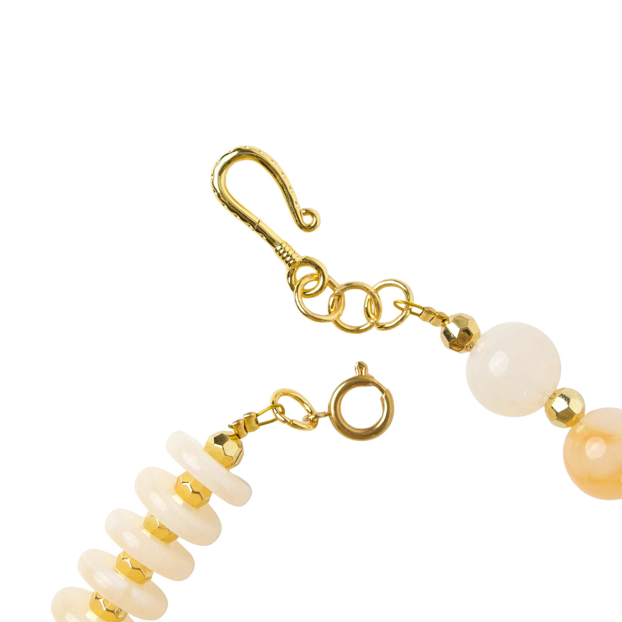 Layered ivory statement necklace featuring coconut-inspired beads, faceted clear stones, brushed gold accents, and neutral coastal styling by Sassy Jones.