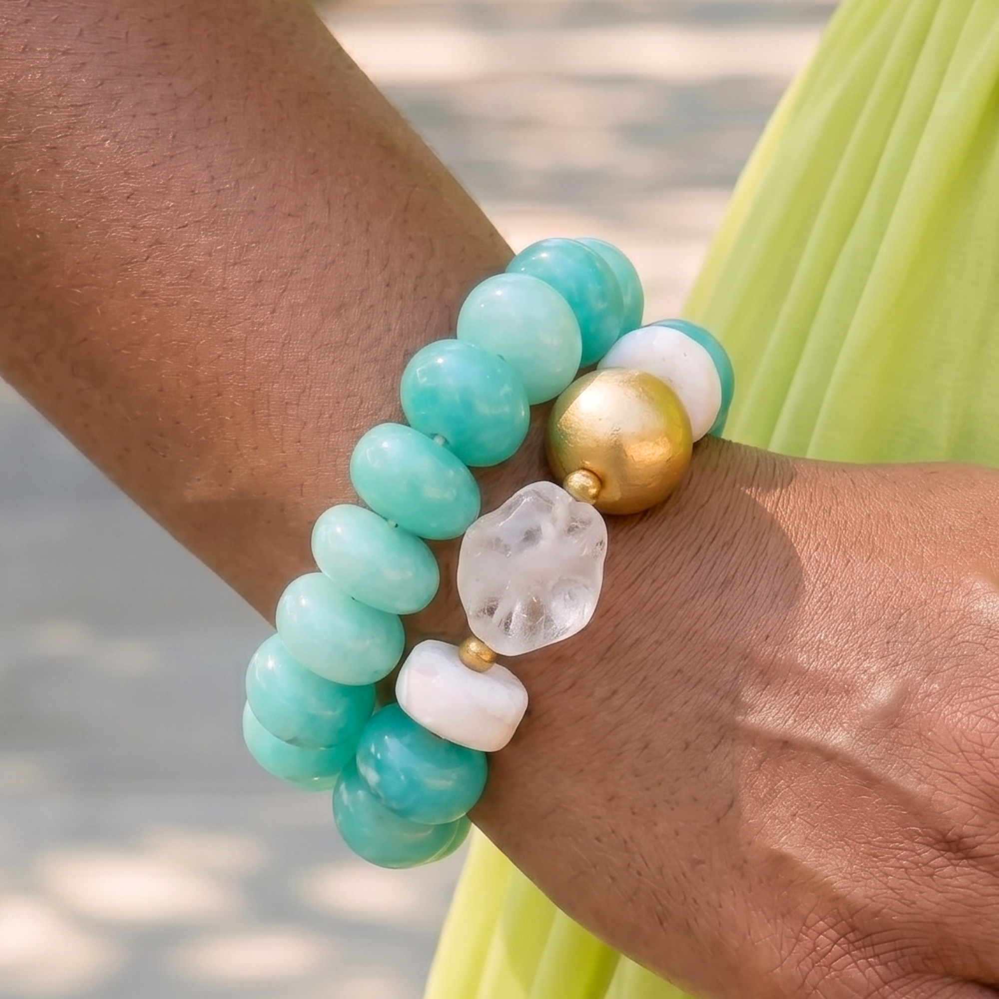 Two-piece bracelet stack featuring marbled Riviera teal beads, frosted sea-glass inspired accents, and gold-tone details by Sassy Jones.