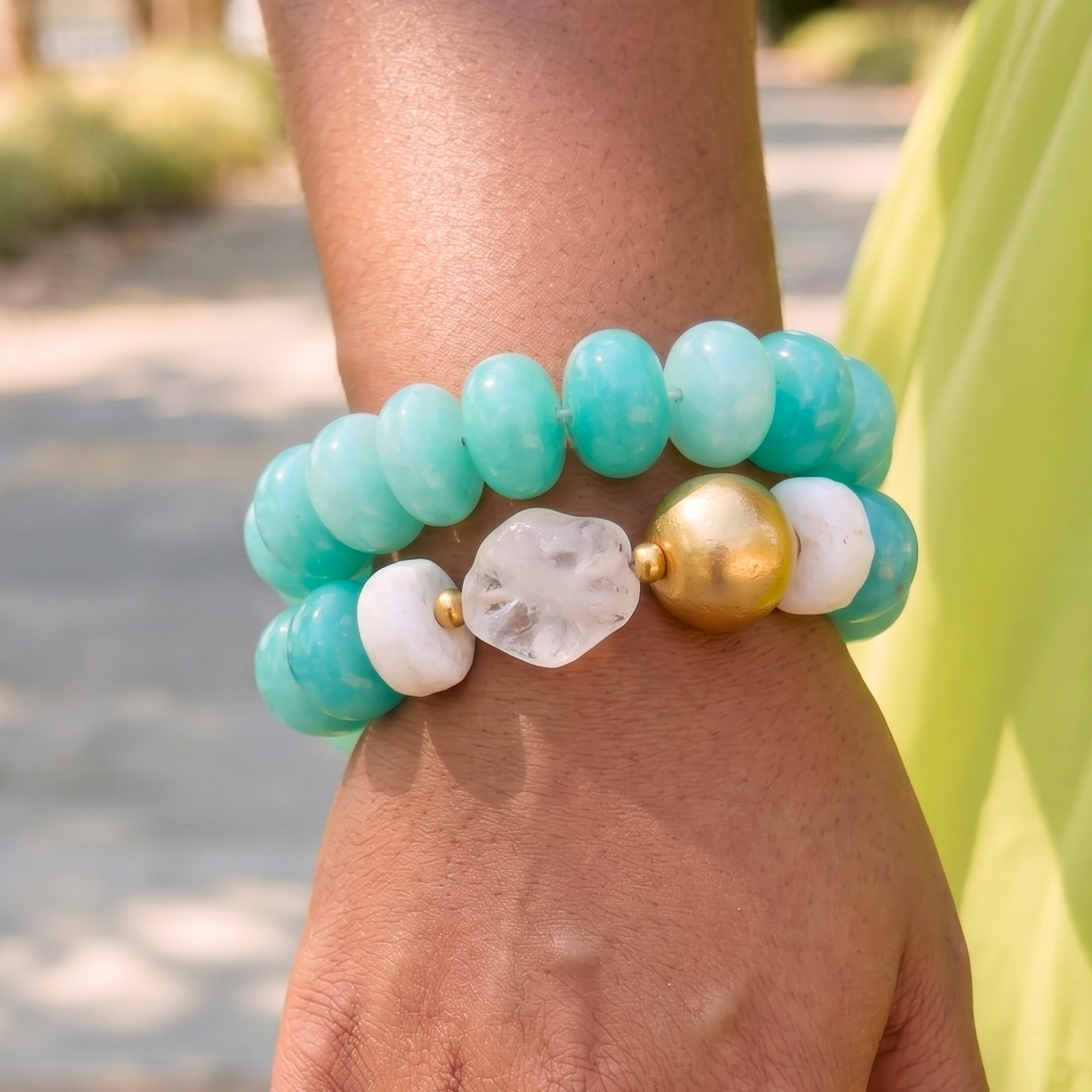Two-piece bracelet stack featuring marbled Riviera teal beads, frosted sea-glass inspired accents, and gold-tone details by Sassy Jones.