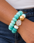 Kamaria Coconut Shell Statement Bracelet Stack in Riviera Teal featuring oversized marbled teal coconut shell pieces and gold accents.