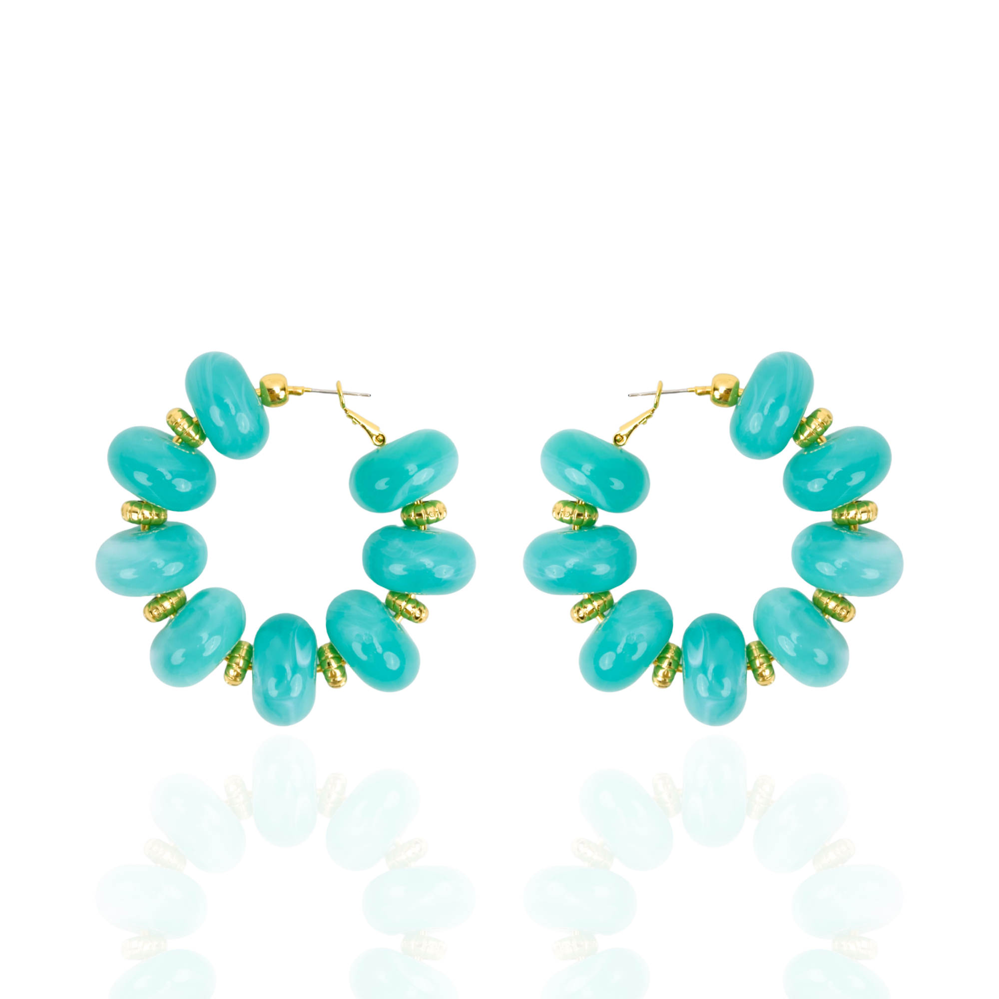 Teal statement hoop earrings featuring oversized marbled turquoise beads and gold-tone accents by Sassy Jones.