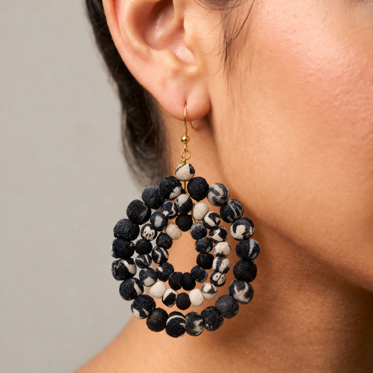 Kenza statement earrings featuring mixed solid and patterned textile wrapped beads in sculptural round drops.