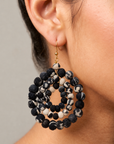 Kenza statement earrings featuring mixed solid and patterned textile wrapped beads in sculptural round drops.