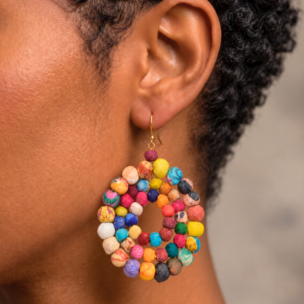 Kenza statement earrings featuring mixed solid and patterned textile beads in sculptural round drops.