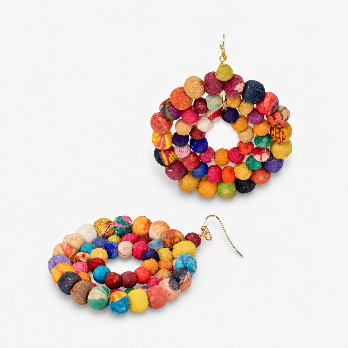 Oversized colorful statement earrings made with orange, pink, blue, yellow and purple textile covered beads.