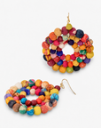 Oversized colorful statement earrings made with orange, pink, blue, yellow and purple textile covered beads.