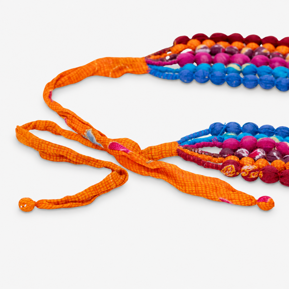 1. Kenza multicolor statement necklace with layered cloth beads in vibrant jewel and citrus inspired shades.