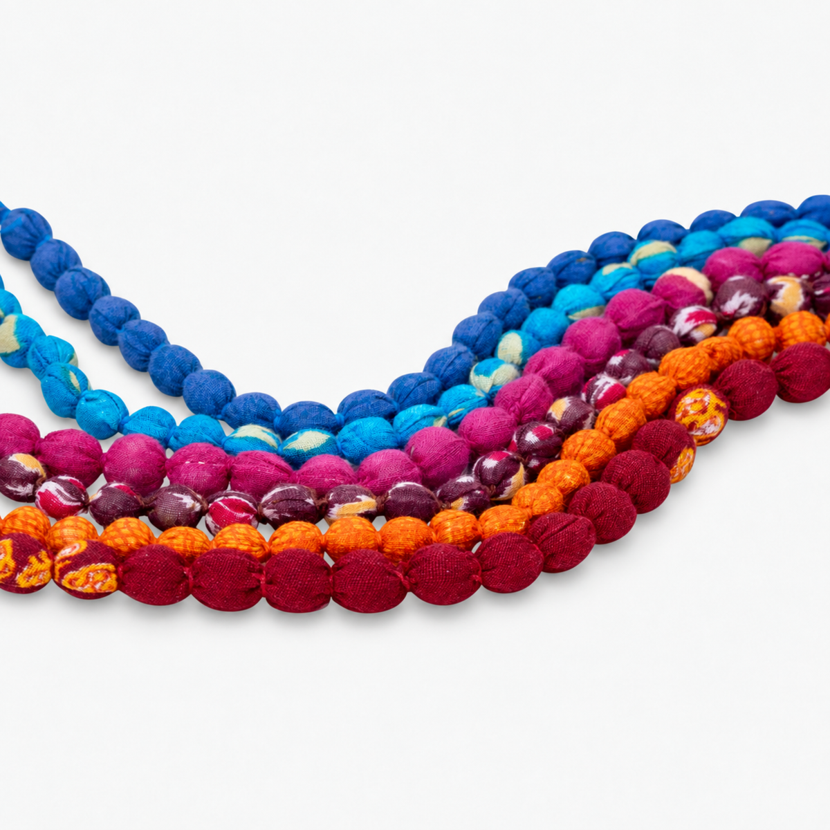 Multicolor statement bib necklace with orange, berry, blue, turquoise and magenta cloth beads.