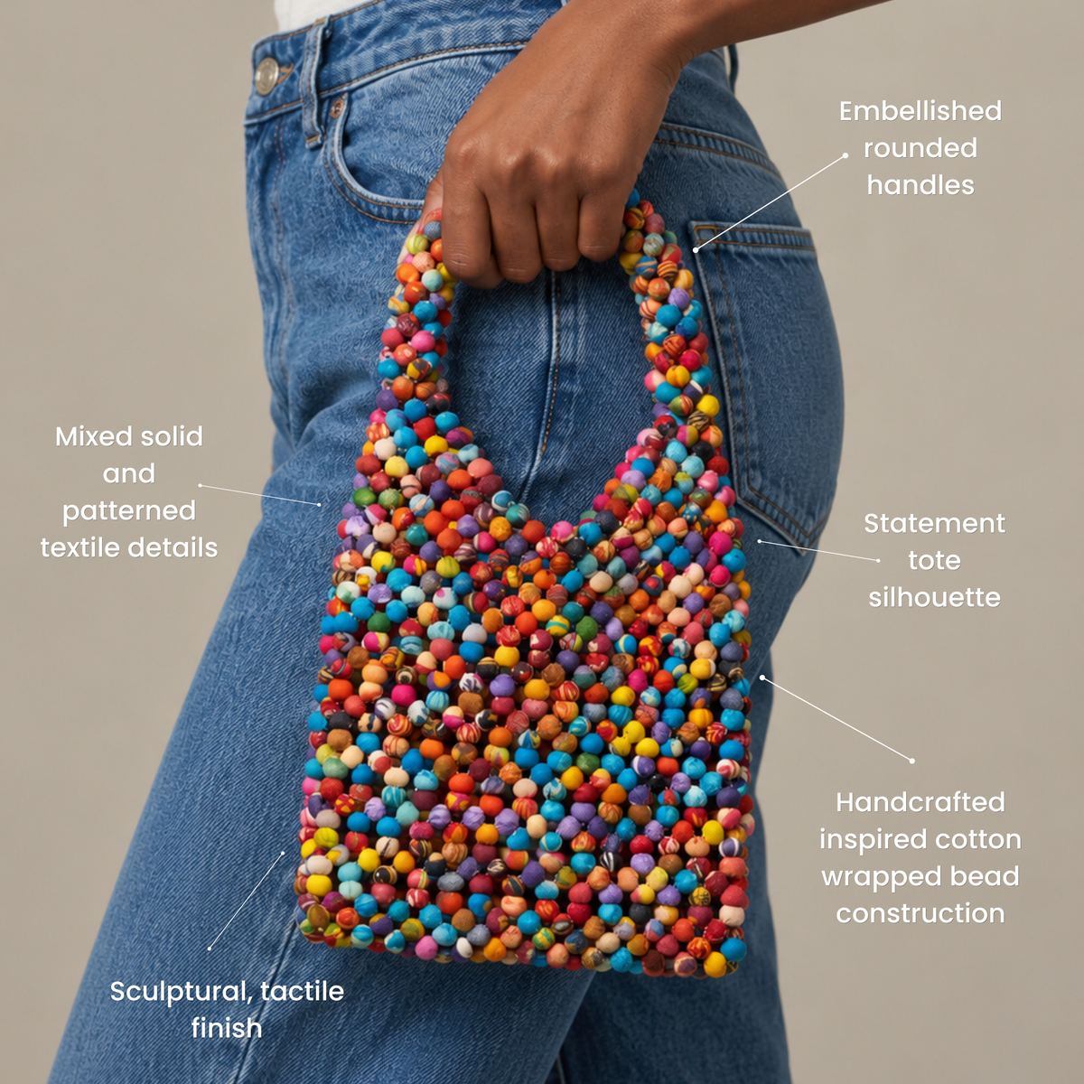Sassy Jones Kenza tote featuring colorful textile wrapped beads across the body and rounded handles.