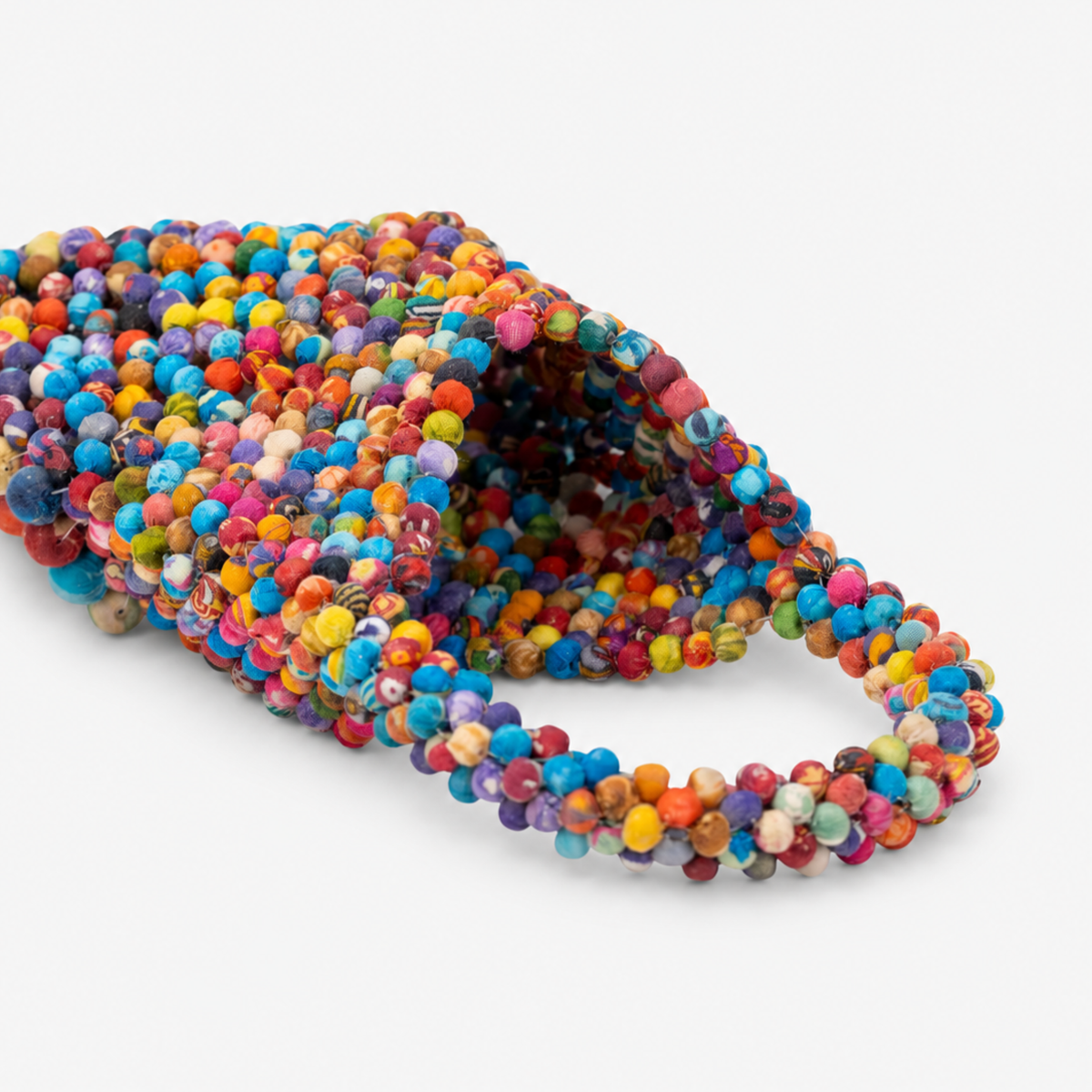 Multicolor statement tote bag covered in dimensional cloth beads in pink, blue, orange, green, yellow and purple.