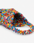 Multicolor statement tote bag covered in dimensional cloth beads in pink, blue, orange, green, yellow and purple.