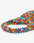 1. Kenza multicolor beaded tote featuring mixed solid and patterned fabric wrapped beads from handle to base.