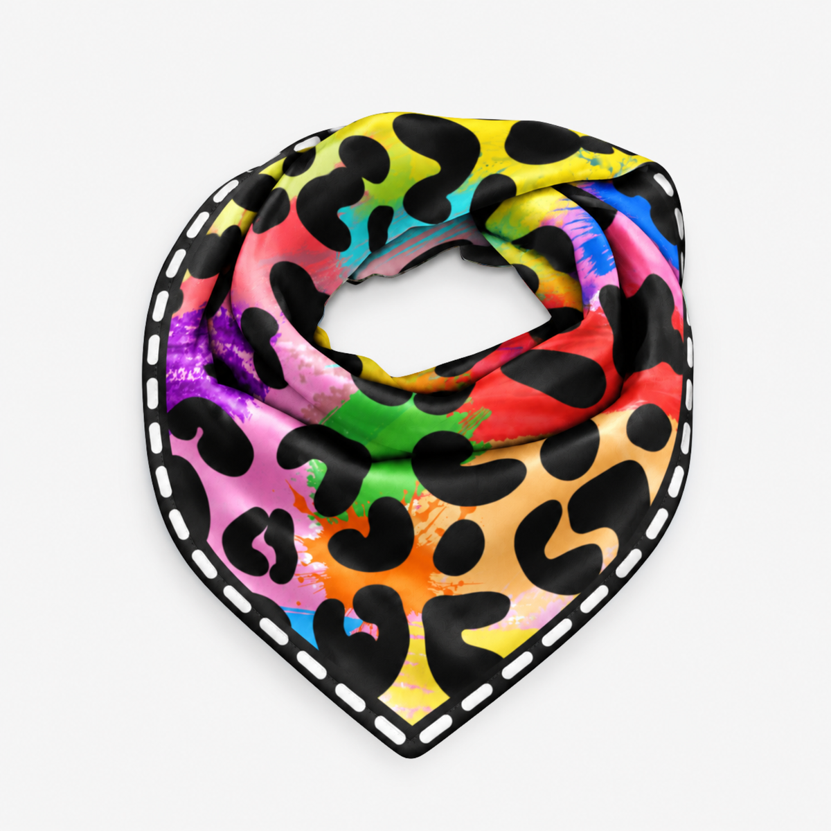 A square scarf with a vibrant rainbow watercolor splatter background and black leopard spots, finished with a white dashed border, shown on a light gray background.