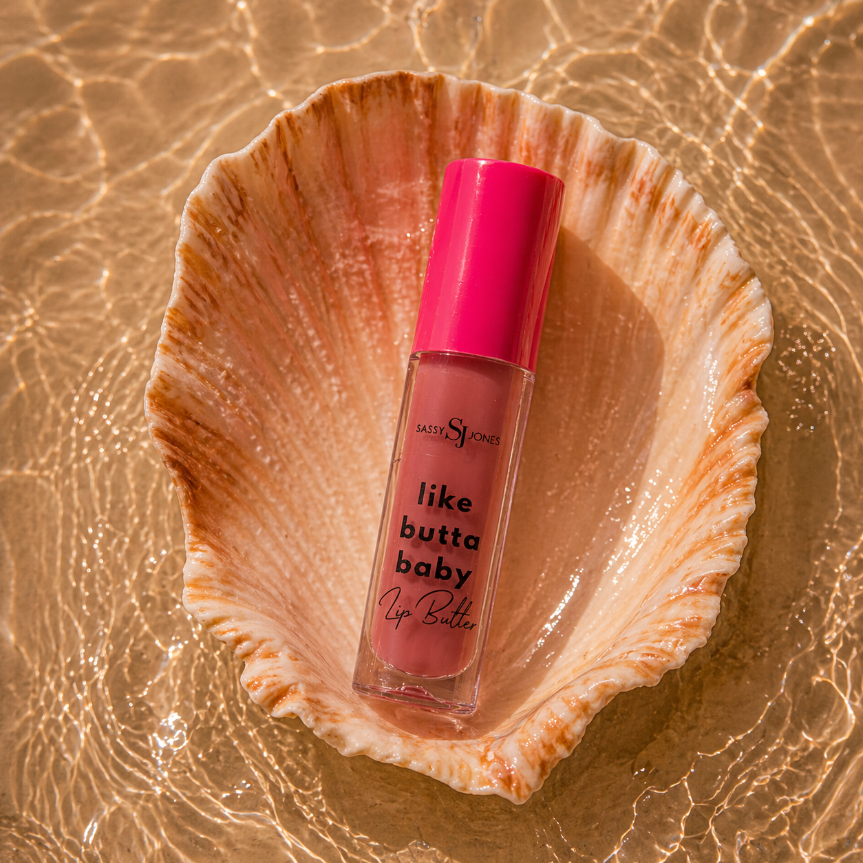 Soft Life Lip Butter gloss in a vibrant coral red shade with high shine finish and smooth creamy texture