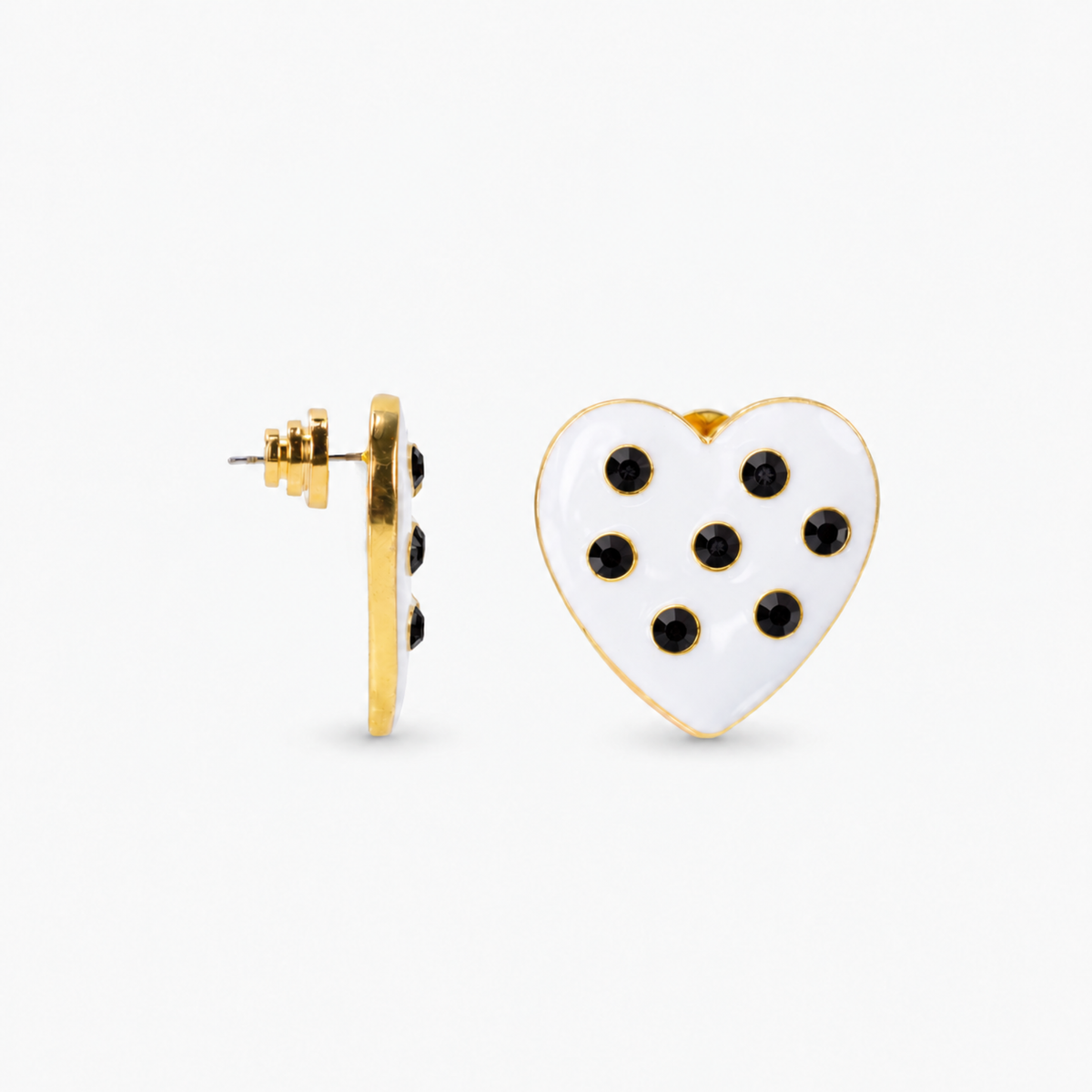 Lovebug statement studs featuring white hearts, round black crystals and 18K gold plated detailing.