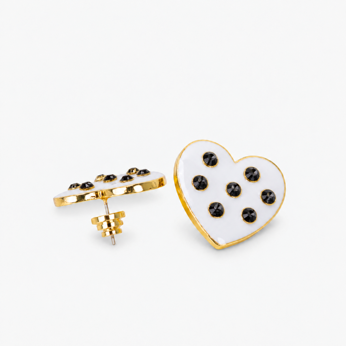 Lovebug 18K Studs - Black/White featuring glossy white heart shapes with black crystal accents.