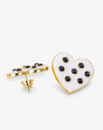 Lovebug 18K Studs - Black/White featuring glossy white heart shapes with black crystal accents.