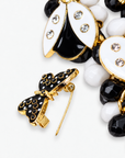 Lovebug 18K Brooch Bib - Black/White featuring layered black and white beads with removable heart, butterfly and ladybug motifs.