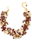 Crimson and cream statement bib necklace featuring removable butterfly, ladybug, and heart brooch charms with 18K gold-plated accents and faceted bead details.
