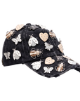 Black distressed denim ballcap featuring removable butterfly, ladybug, heart, and floral crystal brooch pins by Sassy Jones.