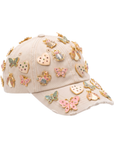 Tan distressed denim ballcap featuring removable butterfly, ladybug, heart, and floral crystal brooch pins by Sassy Jones.
