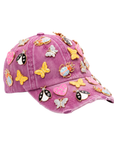 Pink distressed denim ballcap featuring removable butterfly, ladybug, heart, and floral crystal brooch pins by Sassy Jones.