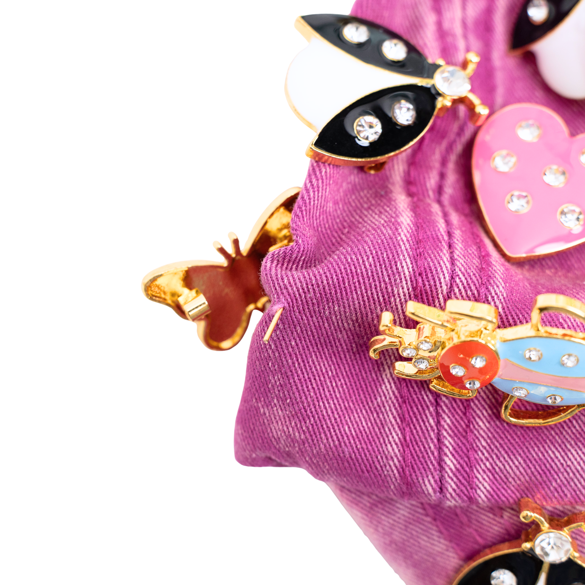 Pink distressed denim ballcap featuring removable butterfly, ladybug, heart, and floral crystal brooch pins by Sassy Jones.