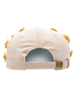 Tan distressed denim ballcap featuring removable butterfly, ladybug, heart, and floral crystal brooch pins by Sassy Jones.