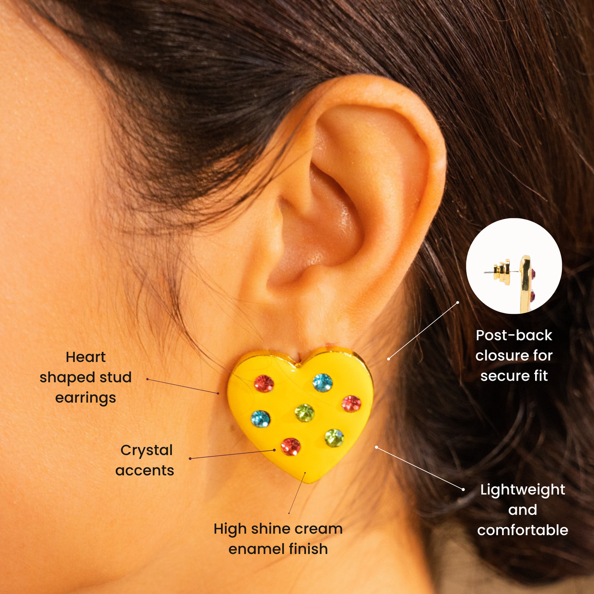 Yellow heart statement stud earrings featuring red, blue and green crystal embellishments with polished gold edging.