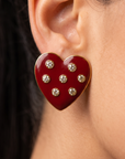 Crimson heart statement earrings featuring scattered round crystals and a polished 18K gold plated border.