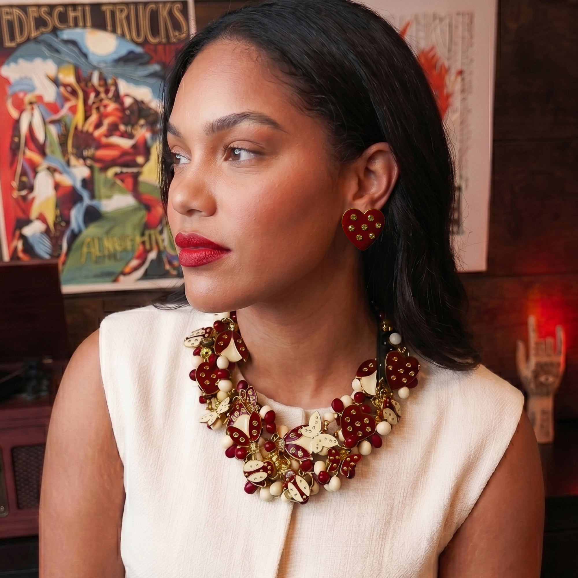 Crimson heart-shaped stud earrings with crystal accents and 18K gold-plated trim from the Lovebug collection