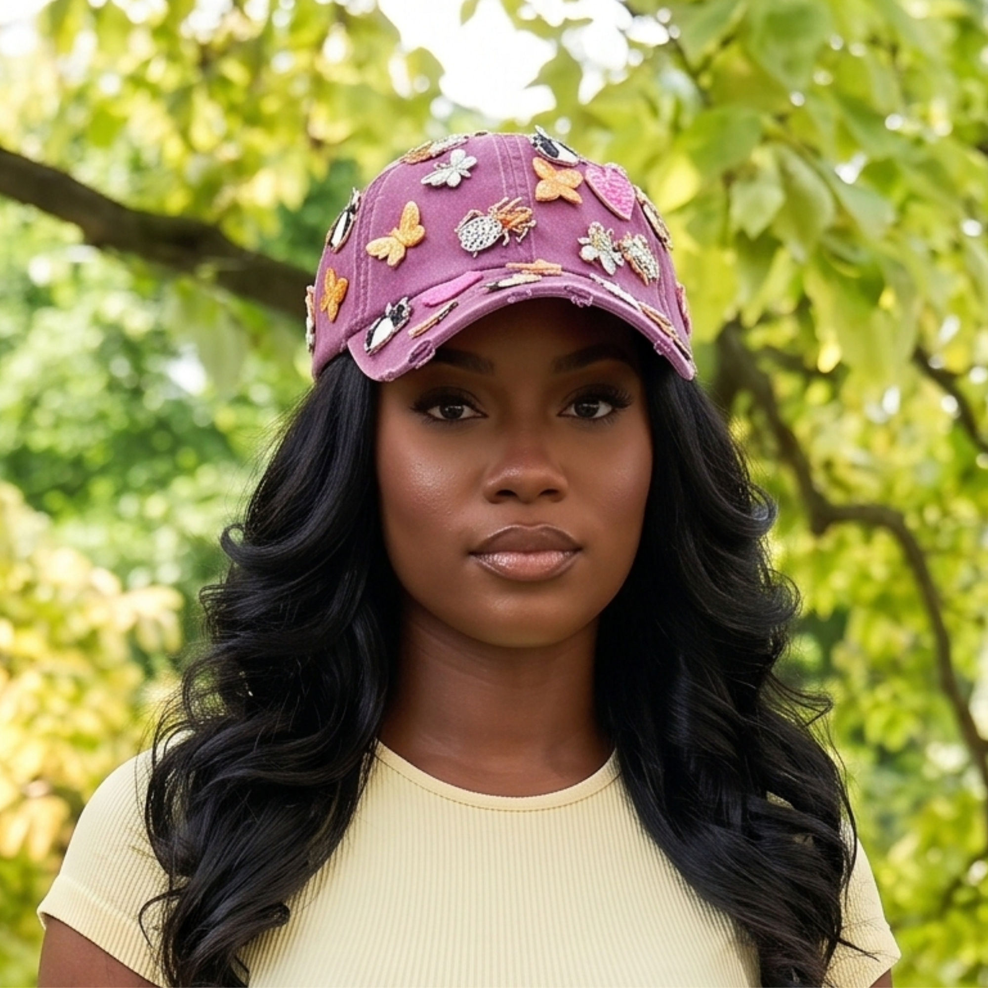 Pink distressed denim ballcap featuring removable butterfly, ladybug, heart, and floral crystal brooch pins by Sassy Jones.