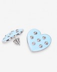 Lovebug Greige heart earring shown on model with soft blue finish and round crystal details. Oversized blue heart stud earring featuring polished edging and scattered clear crystals.
Lovebug statement studs featuring a smooth pastel blue heart silhouette with sparkling crystal accents.
Close up of Lovebug Greige Stud featuring glossy light blue finish and seven brilliant crystal details.