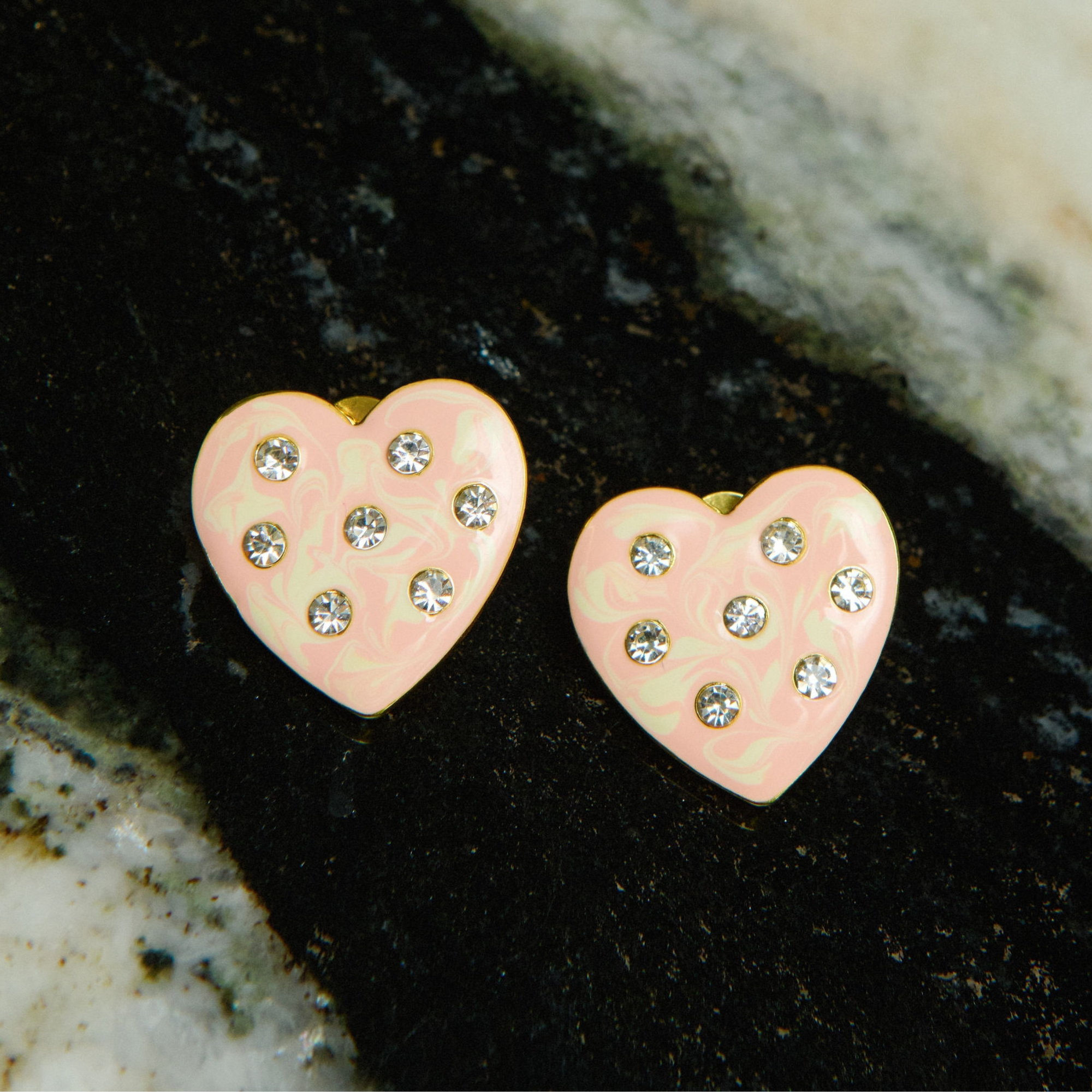 Cream marbled heart-shaped stud earrings with crystal accents and 18K gold-plated trim from the Lovebug collection.