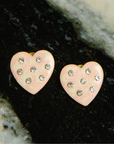 Cream marbled heart-shaped stud earrings with crystal accents and 18K gold-plated trim from the Lovebug collection.