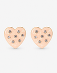 Lovebug 18K Studs in Cream featuring oversized marbled cream hearts with clear crystal accents and gold trim.