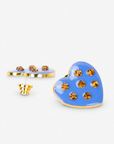 On model view of Lovebug Paradise Blue heart stud earring with warm golden crystals and polished gold edging.